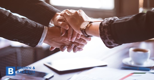 A handshake between attorney and client after successful podiatry lawsuit