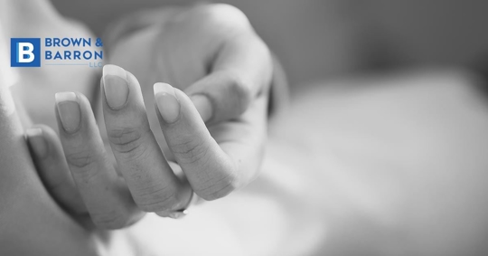 A woman's lifeless hand