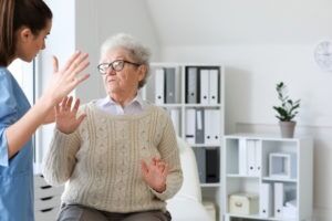 Nurse talking to an elder woman