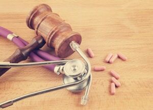 Court mallet and pink pills