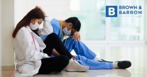 Medical employees sitting on the floor