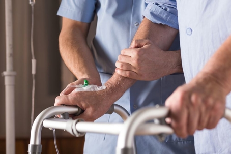 doctor helping patient in nursing home