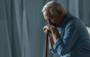 Older man holding a cane