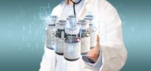 Doctor holding bottles of medication